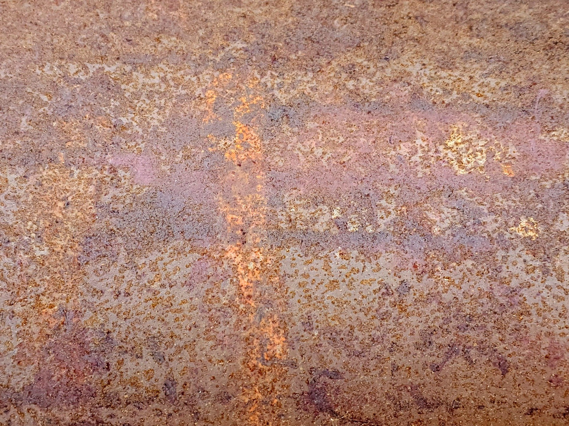 Rough orange oxide, iron turns to dusty flakes, time eats through the core