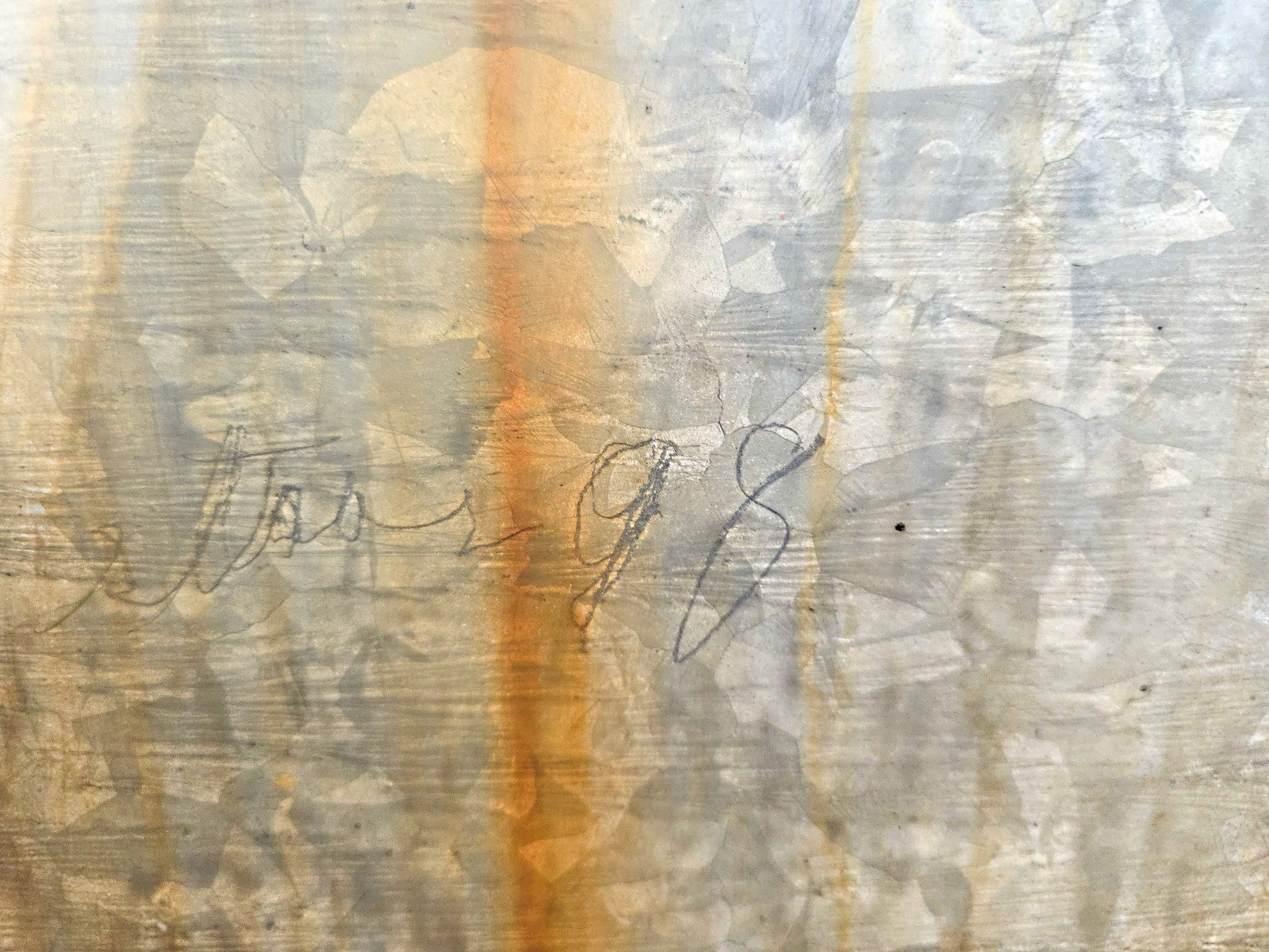 Rust bleeds down the steel, pencil marks from years ago, metal holds the past