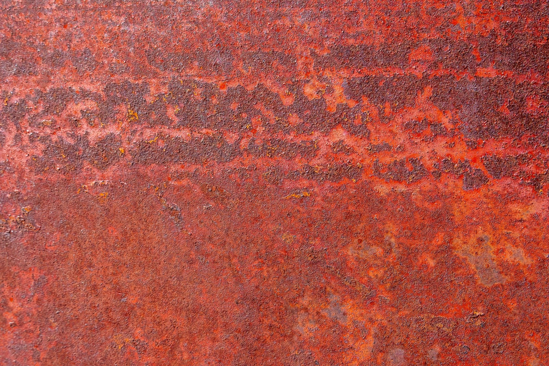 Silver skin turns to grit, jagged scars trace the heavy field, light carves the metal