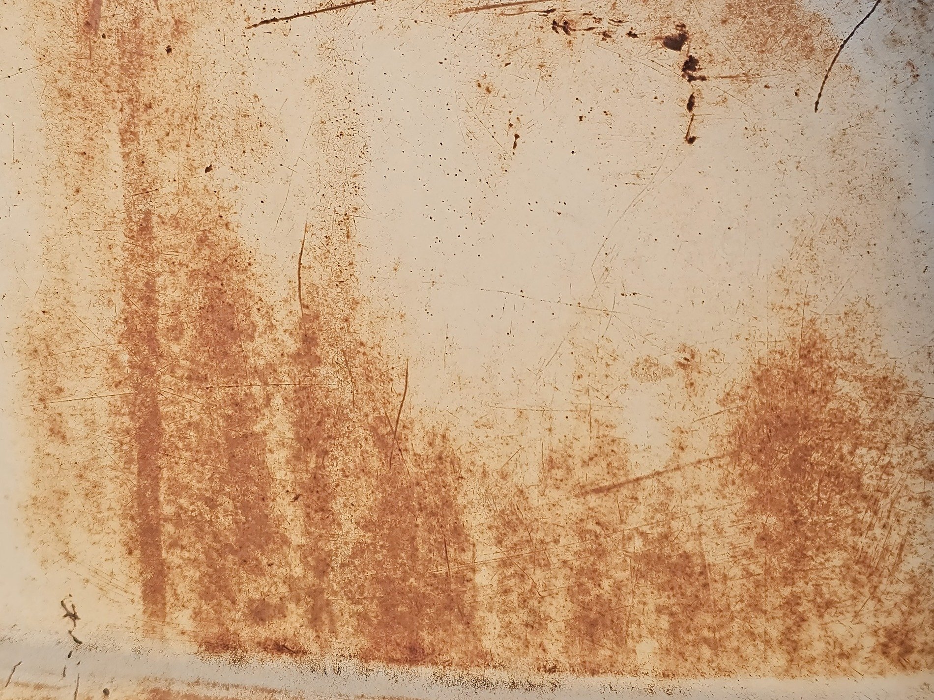 Stenciled lines meet the grit, heavy paths trace the surface, time marks the metal