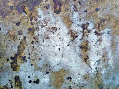 Blue fields meet the rust, orange spots claim the edge, grit holds the finish