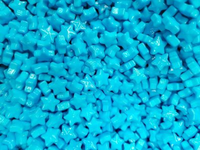 Blue flowers hold fast, ornate paths trace the silver, paper meets the wood