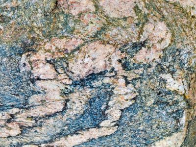 Blue shards meet the frost, orange veins bleed on the skin, light catches the edge