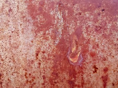 Iron turns to rust, warm red dust coats the surface, time eats the metal