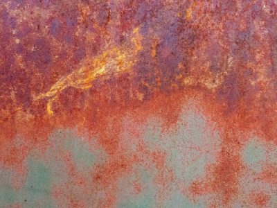 Blue skin peels away, jagged edges meet the light, light catches the grit