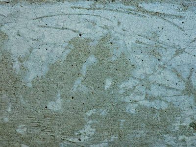 Blue stone holds the cold, thin cracks web across the face, time carves out the marks