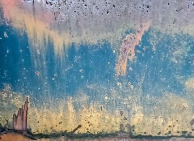 Blue streaks flow deep, vertical paths trace the skin, grit marks the finish