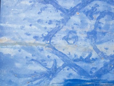 Blue sweeps on the cold, weathered paint tells of the past, metal holds the hue