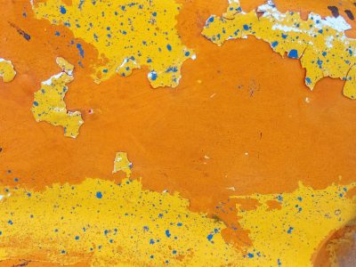 Bright yellow peels back, orange fields stretch far and wide, blue specks dot the heat