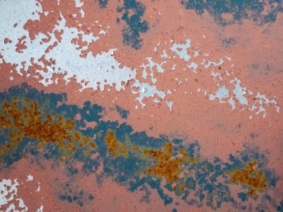 Brown grit claims the field, jagged pits meet the soft light, years leave a deep trace