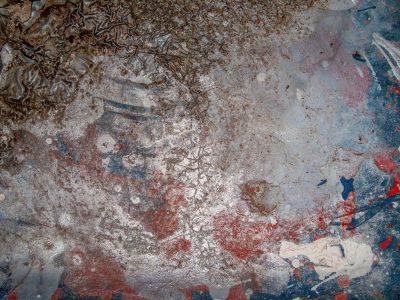 Bubbled silver sheen, red and blue paint fade to grey, iron starts to turn