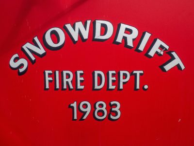 Dark field holds the light, pale spots scatter on the skin, grit marks the finish