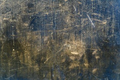 Dark fields meet the grey, jagged lines trace the surface, light marks the finish