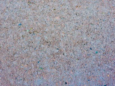 Dark grains flow through deep, jagged patterns meet the grey, grit holds the finish