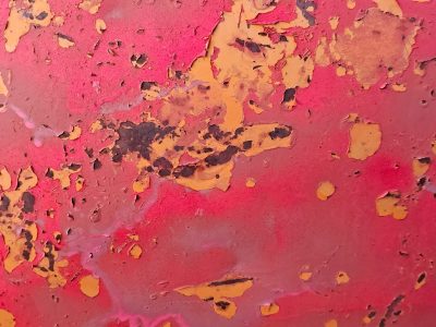 Green layers lift up, orange grit claims the core, years leave a deep trace