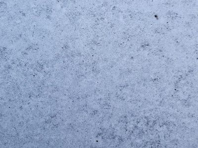 Grey skin carves the cliff, jagged ridges meet the light, grit marks the stone