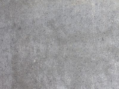 Grey stone meets the light, rough grains of dust and gravel, solid ground remains