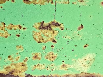 Mint paint starts to peel, rust clouds float on a green sea, metal meets the air