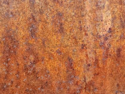 Orange blooms of age, iron turns to dust and grit, time wears down the steel