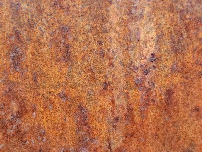 Orange dust claims light, heavy grit claims the metal, years leave a deep trace