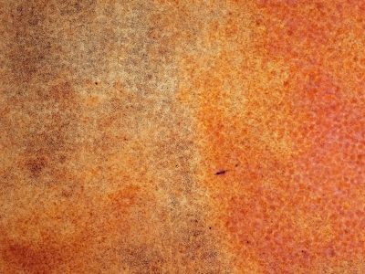 Orange dust claims the light, heavy grit claims the surface, time marks the finish