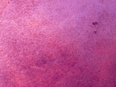 Pink dust settles deep, magenta metal ages, surface starts to fade