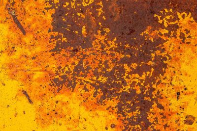 Orange fields meet rust, heavy grit claims the surface, years leave a deep trace