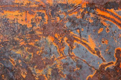 Orange grit flows thick, blue patterns claim the heavy, years leave a deep mark