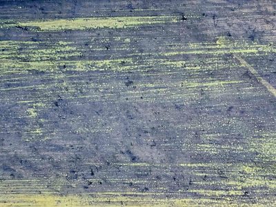 Orange grit flows thick, deep pits mark the surface, time leaves a heavy mark