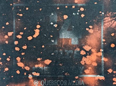 Orange paint splatters, stenciled hours on the box, grit claims every line