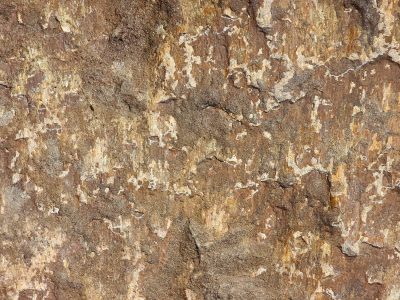 Pink grains meet the grey, mineral veins trace the skin, light carves the finish