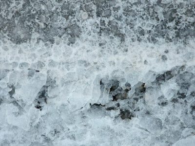 Pink tags meet the grey, jagged lines trace the concrete, art stays in the stone