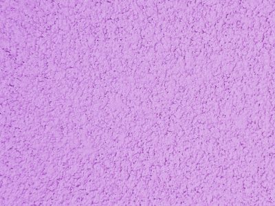 Purple grains arise, textured wall in lilac paint, morning shadows dance