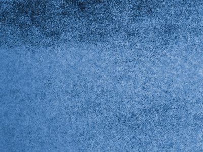 Red fields meet the rust, mottled grain holds the surface, grit marks the finish