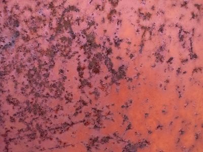 Red paint fades away, iron yields to creeping rust, time eats through the skin