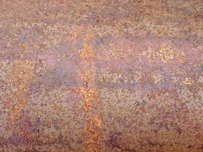 Rough orange oxide, iron turns to dusty flakes, time eats through the core