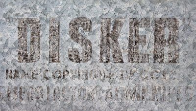 Silver skin has dark paths, "DISKER" marks the heavy field, grit marks the finish