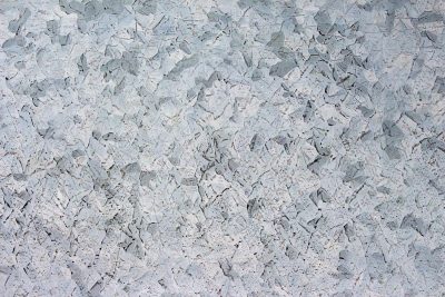 Silver skin has marks, "THE" script holds the heavy field, grit marks the finish