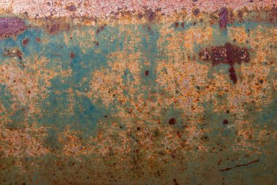 Teal fields meet the grit, orange waves claim the surface, years leave a deep trace