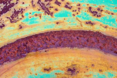 Teal waves meet the rust, orange paths trace the heavy, grit marks the finish