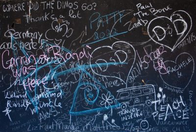 White marks on the grey, jagged paths trace the surface, art stays in the wood