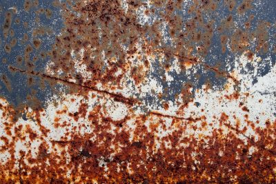 White skin flakes away, blue fields meet the heavy pits, grit marks the finish