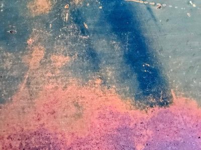 White skin has red trails, vertical streaks trace the field, grit marks the finish