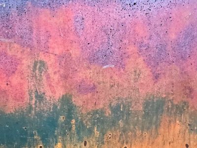 Yellow fields meet grit, heavy orange claims the field, time marks the metal