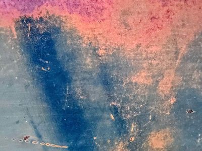 Yellow fields meet rust, orange spots claim the skin, time marks the metal