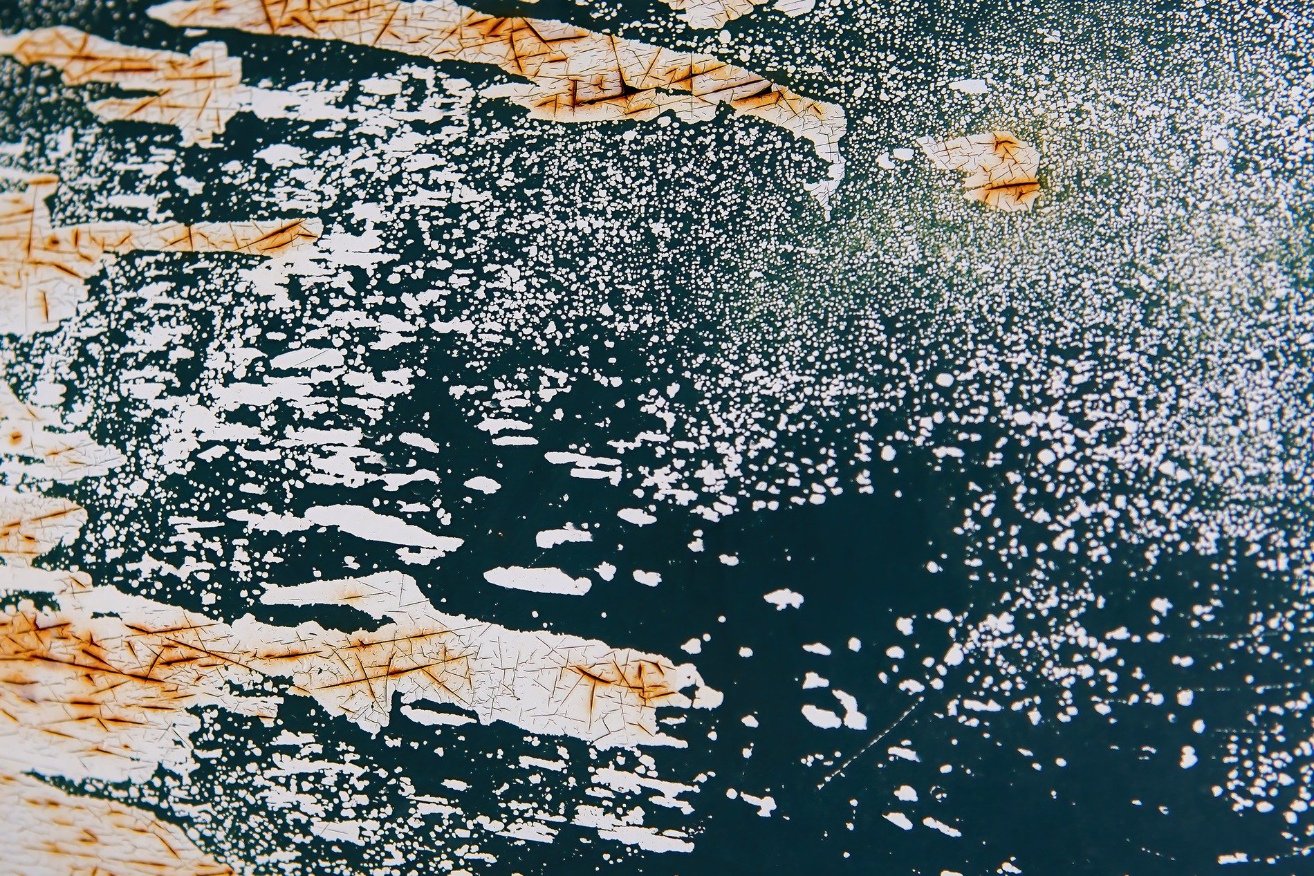 White flakes haunt the blue, jagged paths trace the heavy metal, grit marks the finish