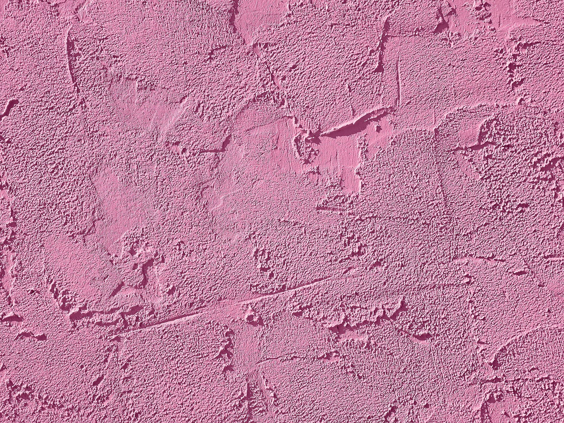 White peaks meet the light, jagged pits trace the skin now, grit holds the pattern