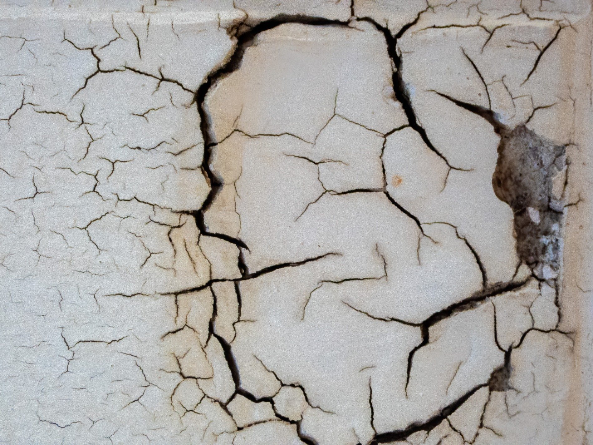 White shell starts to split, dark veins crawl across the wall, surface turns to dust