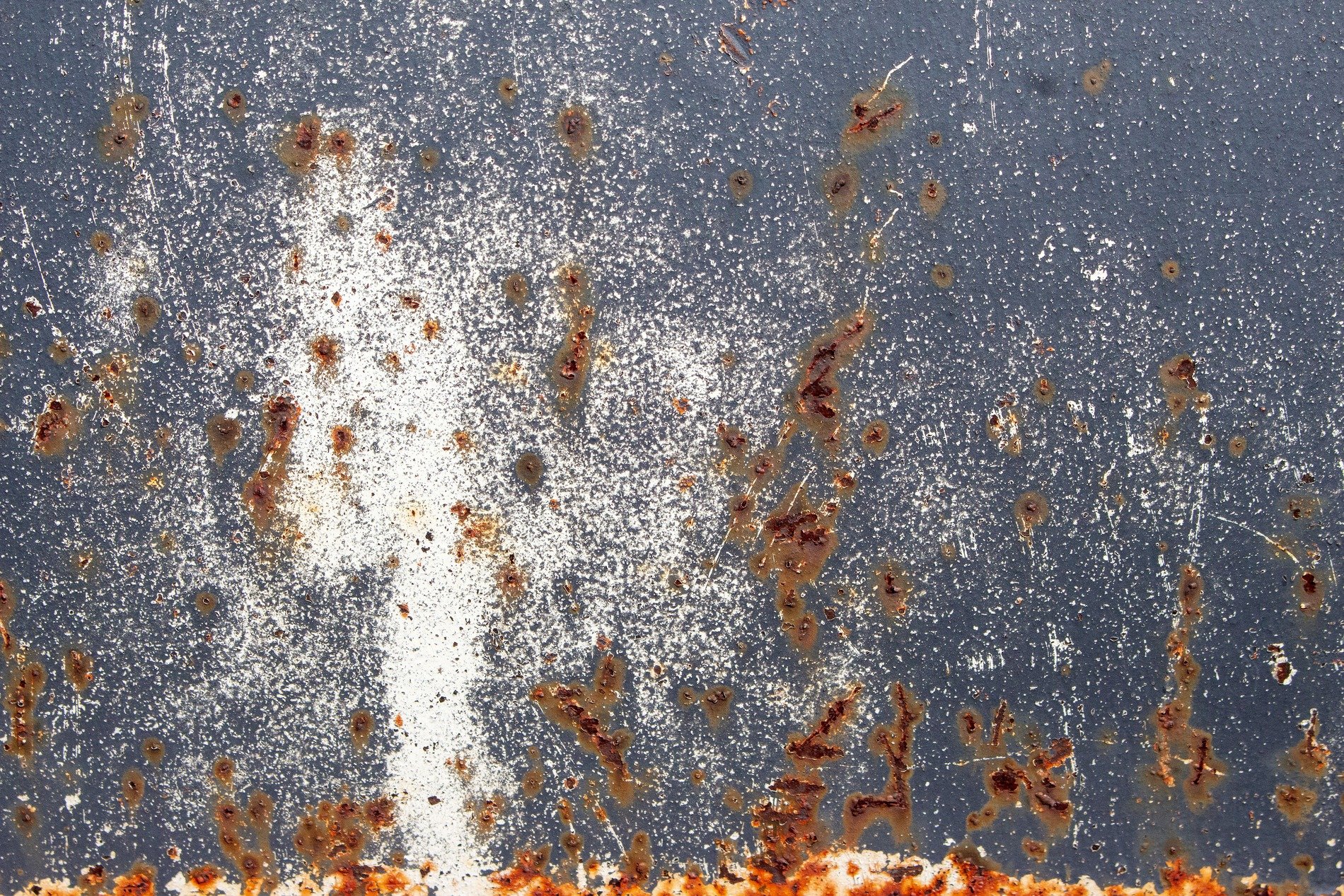 White trails meet the grey, orange rust claims the heavy, grit marks the finish