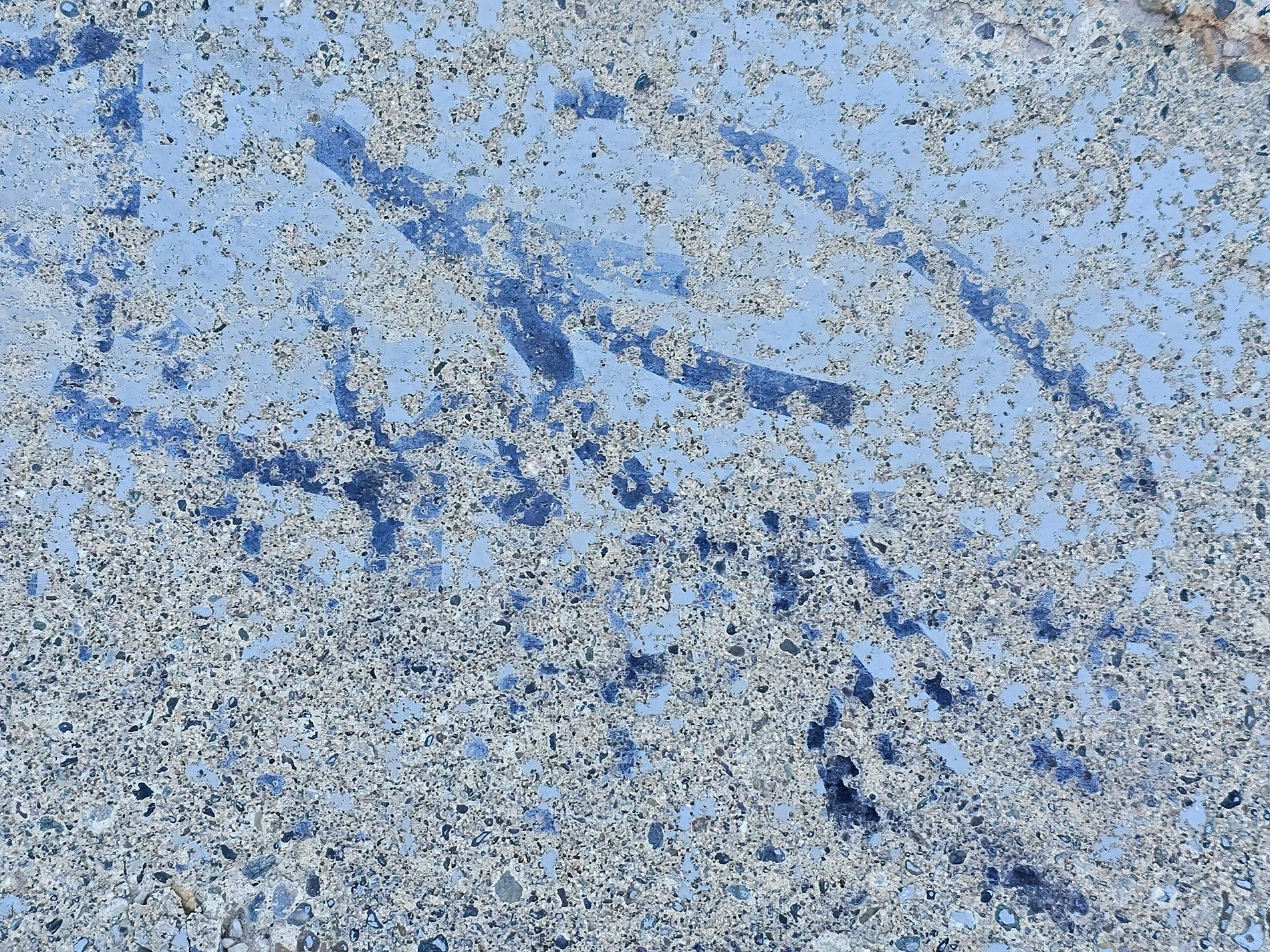 Blue paint wears away, rough stone hides beneath the veil, time leaves behind marks